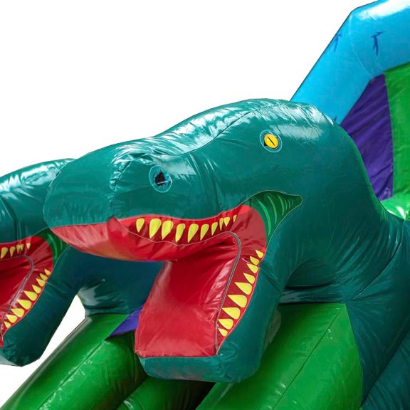Dino-pomppulinna liukumäellä